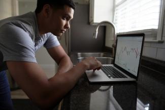 man in gray t-shirt using macbook pro by Joshua Mayo courtesy of Unsplash.